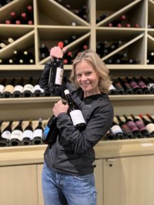 Sonja Magdevski winemaker/owner of Casa Dumetz holding her bottles of wine
