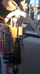 Bernat wine bottle being corked during processing